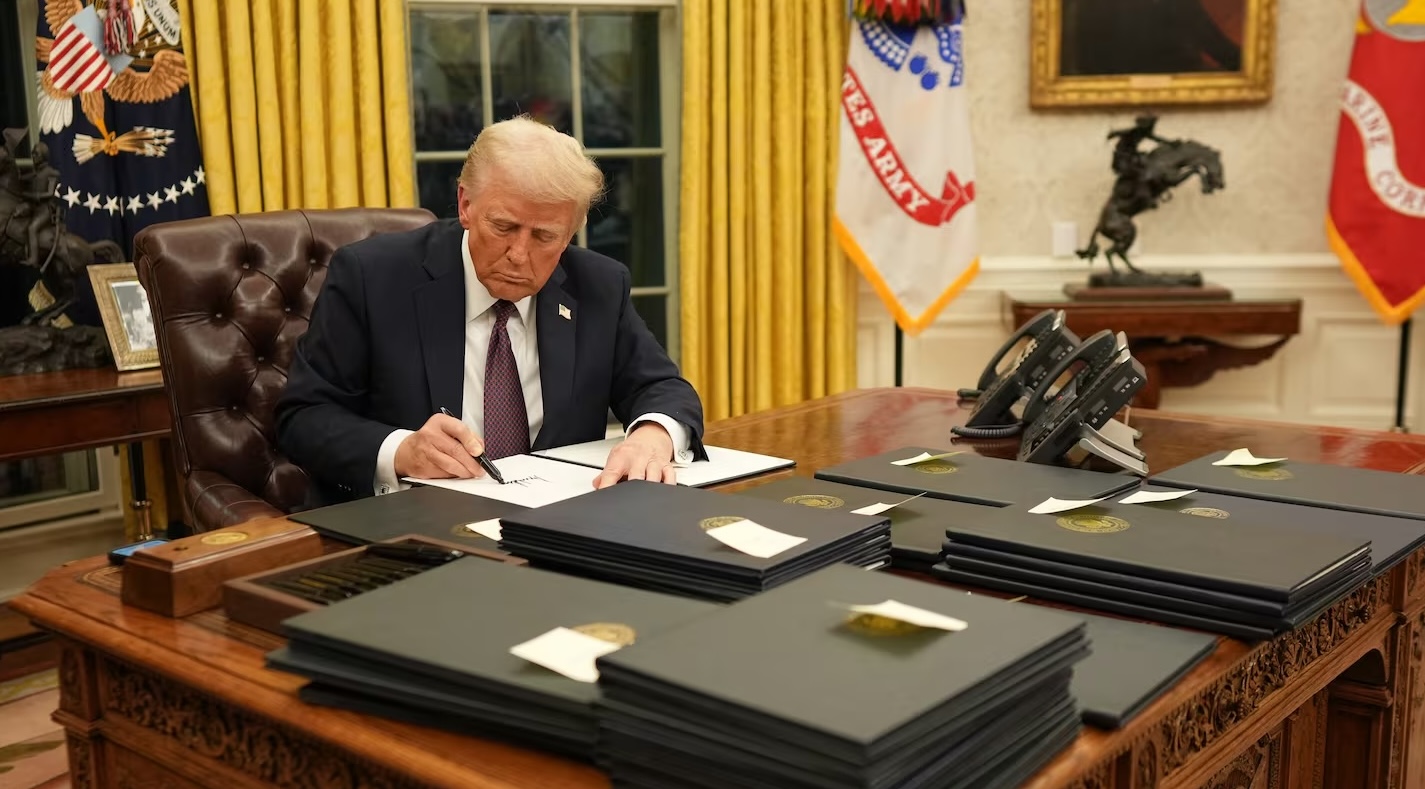 Trump signing executive orders, January 20, 2025. Source: DOUG MILLS/NYT